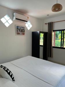 Postel nebo postele na pokoji v ubytování Spiral Resort