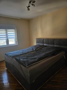 Postel nebo postele na pokoji v ubytování Apartman Cvijetinovic