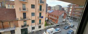 a view from a window of a city street with cars at Design Loft Monteponi in Turin