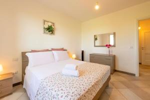 Postel nebo postele na pokoji v ubytování Casa Vacanze Vignarca - Località Perelli
