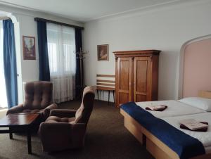 Postel nebo postele na pokoji v ubytování Hotel Lux
