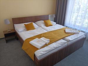 Postel nebo postele na pokoji v ubytování Hotel Eminent