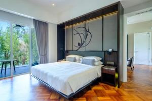 a bedroom with a large white bed and a large window at Lone Pine, Penang, a Tribute Portfolio Resort in Batu Ferringhi