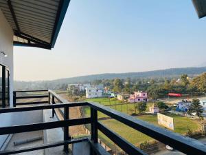 a view from the balcony of a house at Abuzz Oxfordcaps Agrasen Boys Hostel, Dehradun in Dehradun