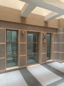 a lobby of a building with glass doors at City Vibe-Sigrou 44 urban studio in Thessaloniki