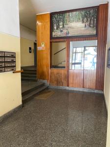 an entrance to a building with a large wooden door at 4routes house in Salerno