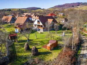 an aerial view of a village with houses at Harghita Traditional House in Szèkelydobò