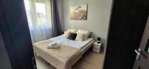 Ένα ή περισσότερα κρεβάτια σε δωμάτιο στο APARTAMENT SORENTO 9