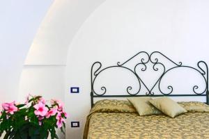 Postel nebo postele na pokoji v ubytování Villa Borgo San Michele