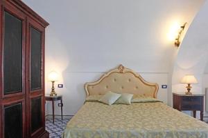 Postel nebo postele na pokoji v ubytování Villa Borgo San Michele