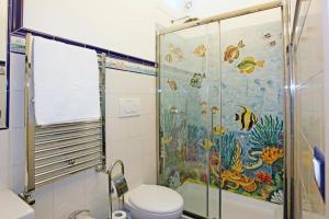 a bathroom with a shower and a toilet at Villa Borgo San Michele in Amalfi