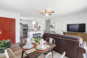 a living room with a couch and a table at Bright and Spacious 2 BR Apartment in Fort Lauderdale