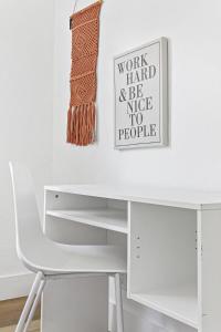 a white desk with a white chair and a picture at Bright and Spacious 2 BR Apartment in Fort Lauderdale +26 photos