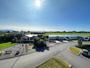 an aerial view of a parking lot with a playground at Cosy and family friendly 3brd apartment in Akranes in Akranes