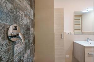 a bathroom with a sink and a shower at West Side Bologna Apartment in Bologna