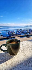 a cup of coffee sitting on top of a table at Il Palazzino in Taranto