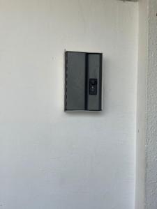 a lightswitch on a white wall at AGODA C VIEW @ Sri Sayang Beach Resort in Batu Ferringhi