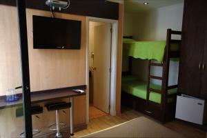 Postel nebo postele na pokoji v ubytování Sur Hotel
