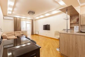 a large living room with a kitchen and a living room at Stay Inn apartments at Buzand 13 street in Yerevan