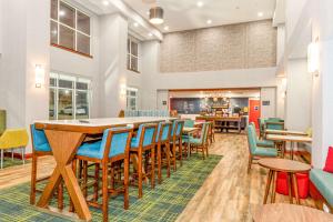a dining room with a long table and chairs at Hampton Inn & Suites Fort Worth-West-I-30 in Fort Worth