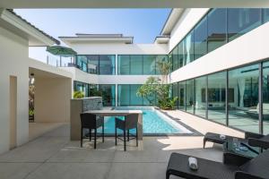 an internal view of a house with a swimming pool at Sun Diego Resort Pool Villa in Jomtien Beach