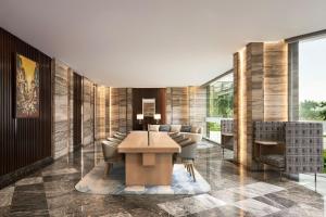 a dining room with a table and chairs at Sheraton Hai Phong in Hai Phong