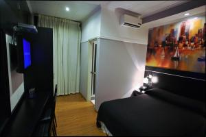 TV a/nebo společenská místnost v ubytování Sur Hotel