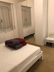 Ένα ή περισσότερα κρεβάτια σε δωμάτιο στο La Casetta Gialla
