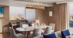 a dining room with a table and chairs at Jumeirah Beach Hotel Dubai in Dubai