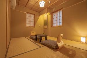 Postel nebo postele na pokoji v ubytování Saju Kyoto 茶住 京都