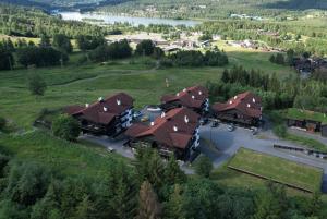 an aerial view of a large house with brown roofs at Alpin Apartments Solsiden in Hafjell