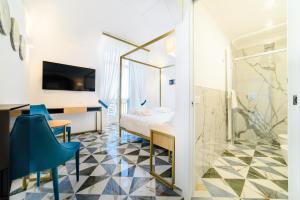 Telewizja i/lub zestaw kina domowego w obiekcie Palazzo Vitagliano
