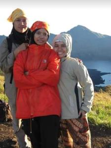 three women posing for a picture on a mountain at RINJANI EXPEDITION BASECAMP in Masbagik