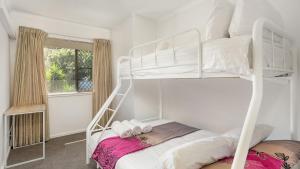 a bedroom with two bunk beds and a window at Nelson on Nelson in Nelson Bay +15 photos