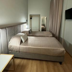 Postel nebo postele na pokoji v ubytování Hotel RomAntica
