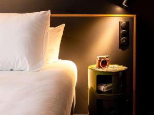 Postel nebo postele na pokoji v ubytování ibis Styles Paris Villejuif