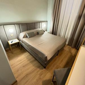 Postel nebo postele na pokoji v ubytování Hotel RomAntica