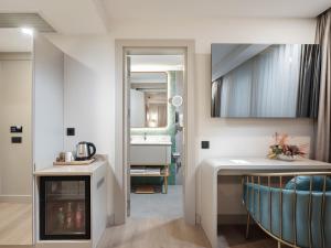 a bathroom with a sink and a mirror at Perla Pura in İzmir