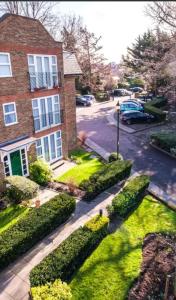 an aerial view of a house with a driveway at The Green Lodge (Bush Hill Park) in Enfield