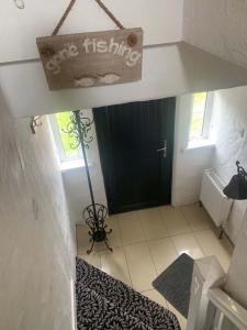 a room with a sign that reads one fishing at Bayview, Dunmore East, County Waterford - Sleeps 12 persons in Dunmore East