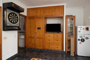 TV a/nebo společenská místnost v ubytování Kite & Surf Nomad House