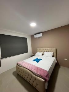Un pat sau paturi într-o cameră la Residencia Costa Y Mar