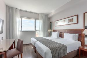 Postel nebo postele na pokoji v ubytování Eurostars Toledo