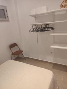 Ένα ή περισσότερα κρεβάτια σε δωμάτιο στο Apartamentos la chanca playa