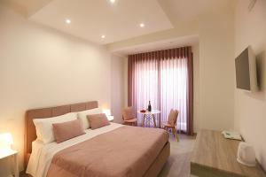 Voodi või voodid majutusasutuse Dorant Charme&Rooms toas