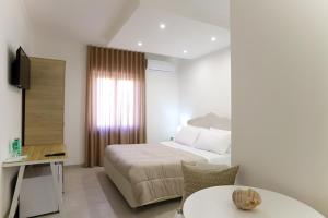 Voodi või voodid majutusasutuse Dorant Charme&Rooms toas