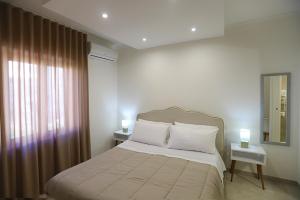 Voodi või voodid majutusasutuse Dorant Charme&Rooms toas