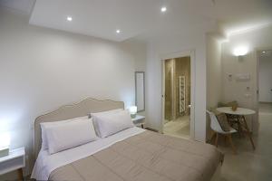 Voodi või voodid majutusasutuse Dorant Charme&Rooms toas