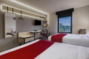 Postel nebo postele na pokoji v ubytování City Express by Marriott Leon + 37 fotografií