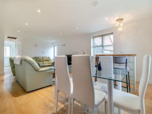 a living room with a table and a couch at The Great Escape in Ipswich